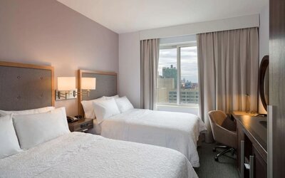 Day use room with work desk and chair at the Hampton Inn Times Square South. 