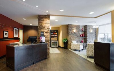 Welcoming reception with comfortable seating at Hampton Inn Times Square South.