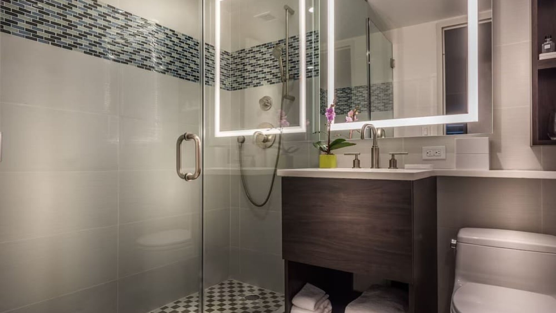 Beautiful, modern bathroom with plush towels at The Bernic Hotel New York City, Tapestry Collection By Hilton.
