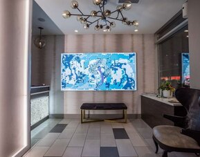 Welcoming reception with seating at The Bernic Hotel New York City, Tapestry Collection By Hilton.