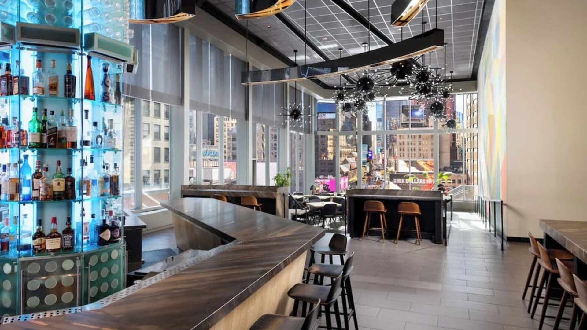 Stylish bar at M Social Hotel Times Square   ideal for unwinding after a busy day.