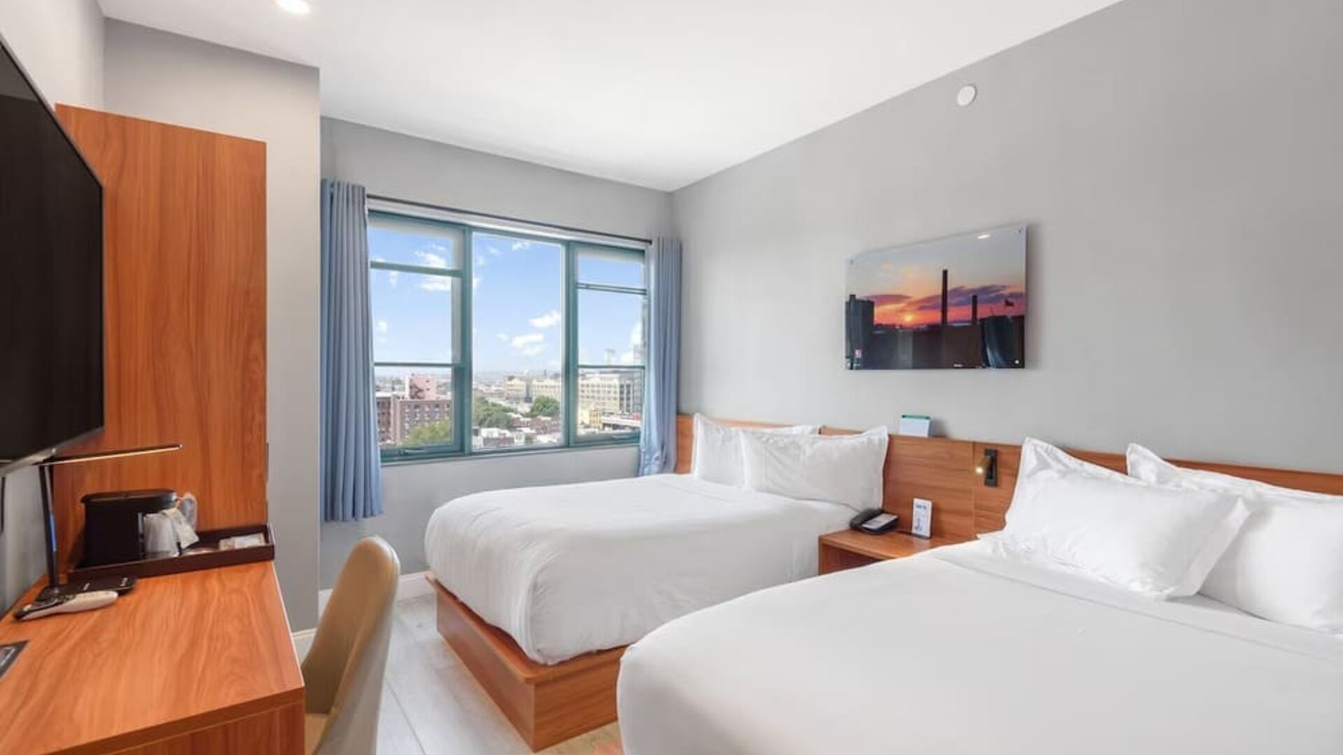 Day use room with work desk and natural light at Liberty View Brooklyn Hotel.