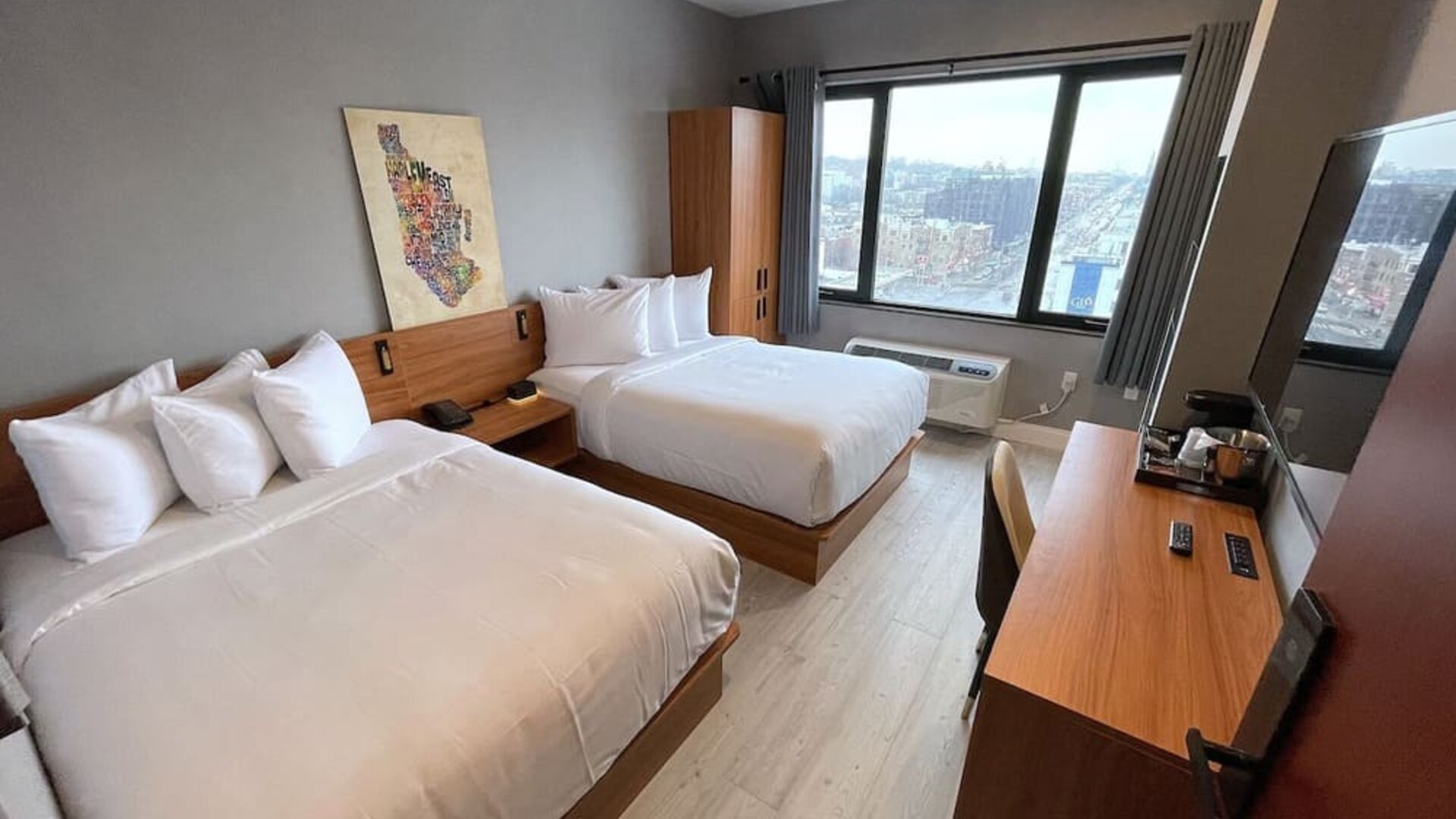 Day use room with work desk and natural light at Liberty View Brooklyn Hotel.