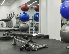 Fitness center available at Courtyard By Marriott Long Island City/New York Manhattan View.