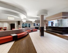 Lobby with comfortable seating at Best Western Premier NYC Gateway.