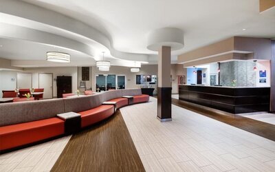 Lobby with comfortable seating at Best Western Premier NYC Gateway.