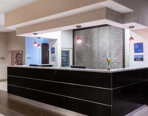 Reception desk at Best Western Premier NYC Gateway.