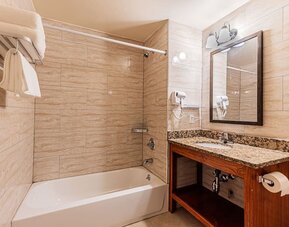 Bathroom at Astoria Inn LaGuardia Hotel.