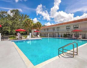 Relaxing outdoor pool at Travelodge by Wyndham Fundamental.