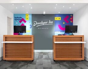 Welcoming reception desk at Baymont by Wyndham Maingate.
