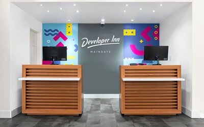 Welcoming reception desk at Baymont by Wyndham Maingate.