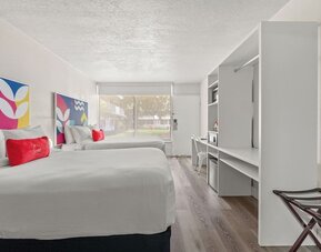 Day room with workspace and natural light at Baymont by Wyndham Maingate.