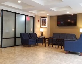 Lobby lounge area at Days Inn By Wyndham Brooklyn Marine Park.