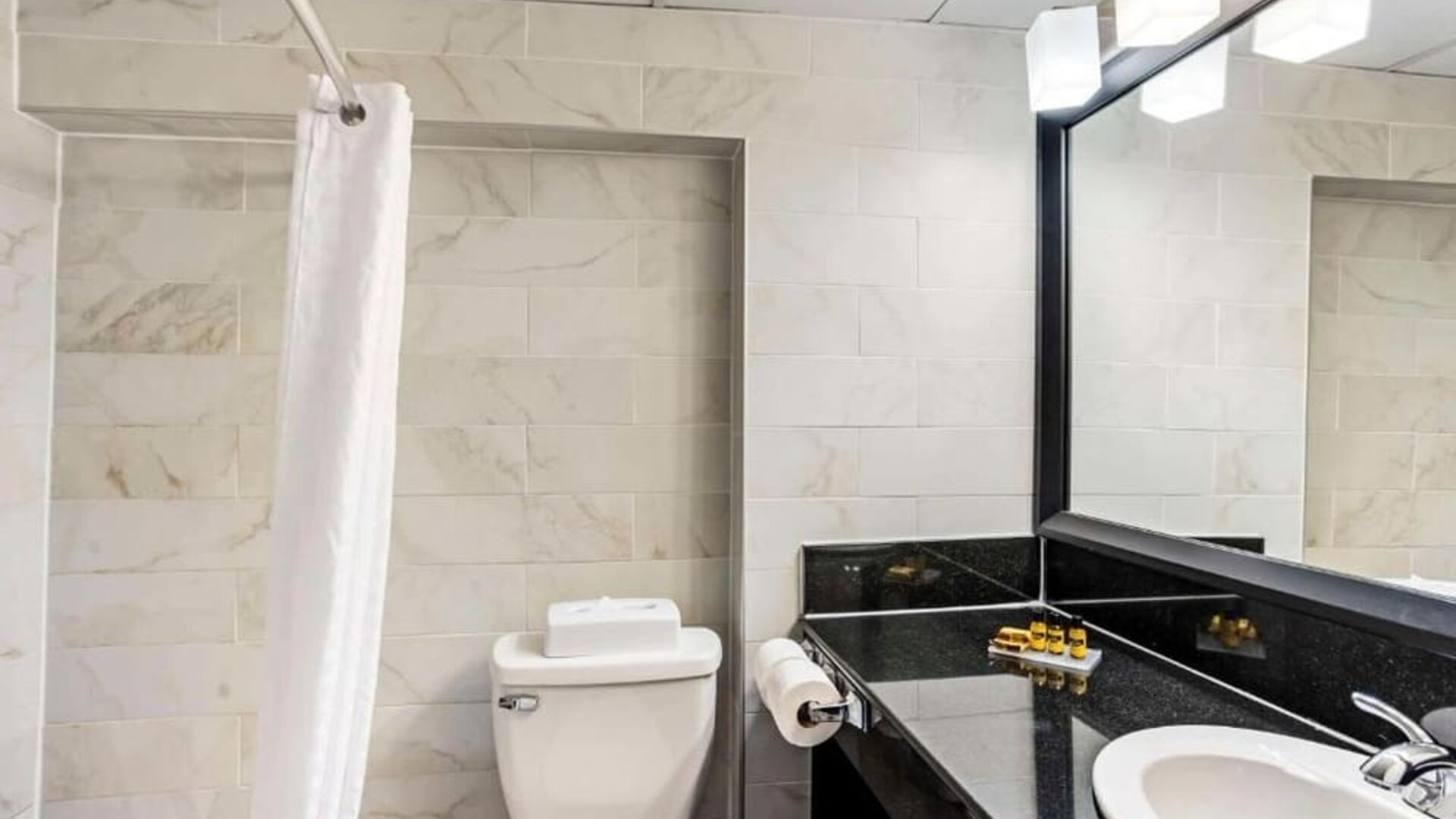 Bathroom with shower at Best Western Plus Newark Airport West.