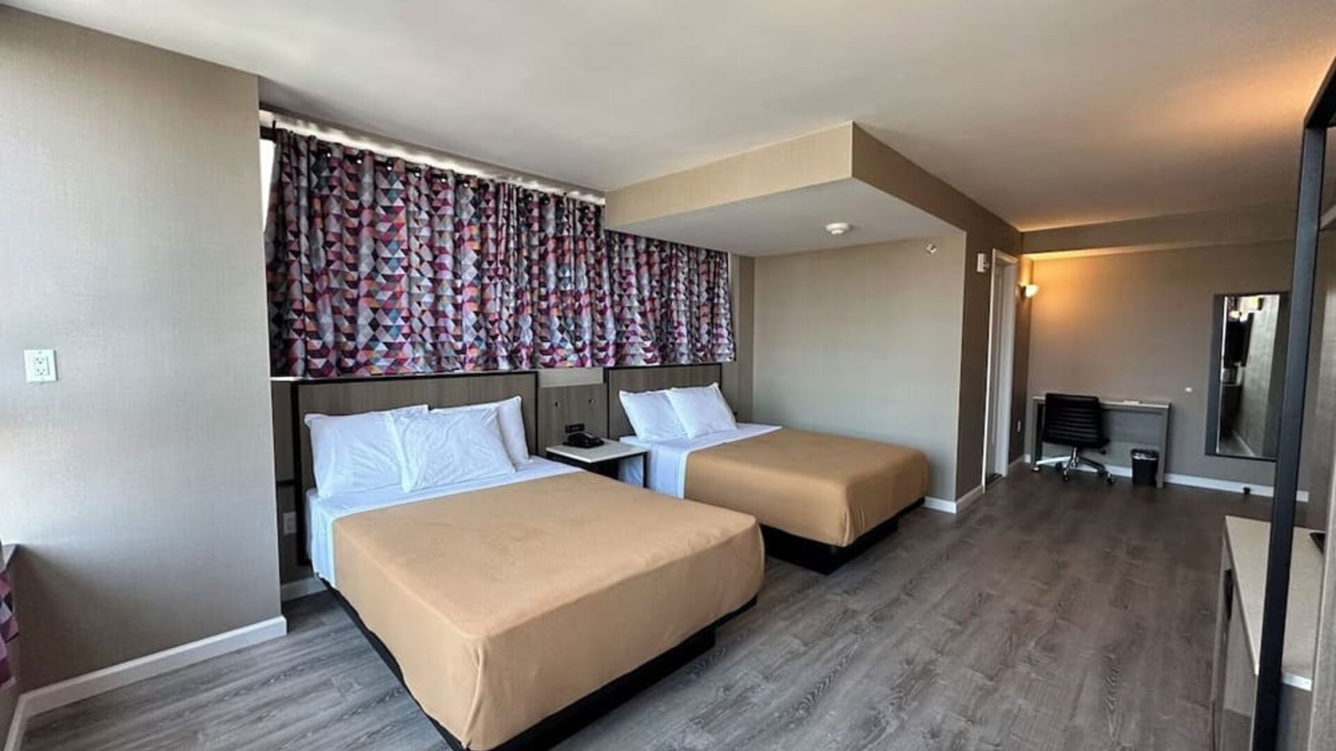 Day use room with work desk at Regal Inn & Suites New York.