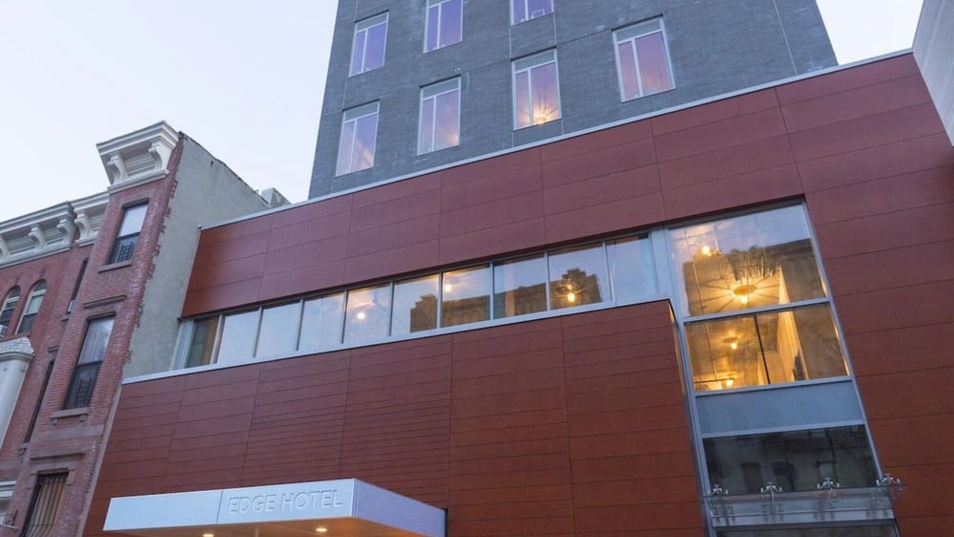 Exterior view of the hotel building with street-level entrance at Edge Hotel NYC.