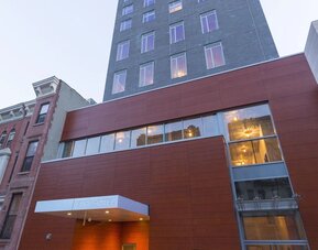 Exterior view of the hotel building with street-level entrance at Edge Hotel NYC.