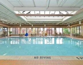 Indoor pool with natural light at DoubleTree By Hilton Wilkes-Barre.