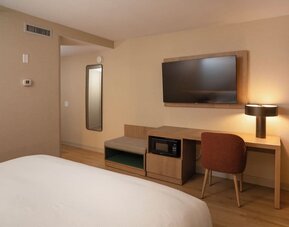 Day use room with TV and work desk at DoubleTree By Hilton Wilkes-Barre.