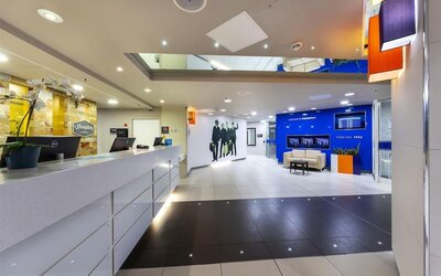Hotel reception wit Beatles wall design at Hampton By Hilton Liverpool/John Lennon Airport.