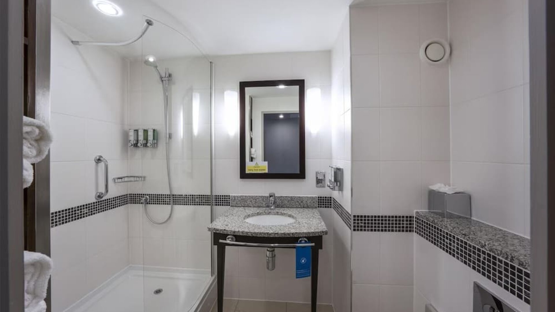 Guest bathroom with bath and shower at Hampton By Hilton Liverpool/John Lennon Airport.