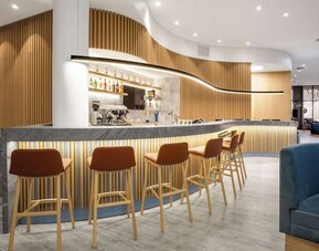 Cozy hotel bar and lounge at Hampton By Hilton Tallinn.