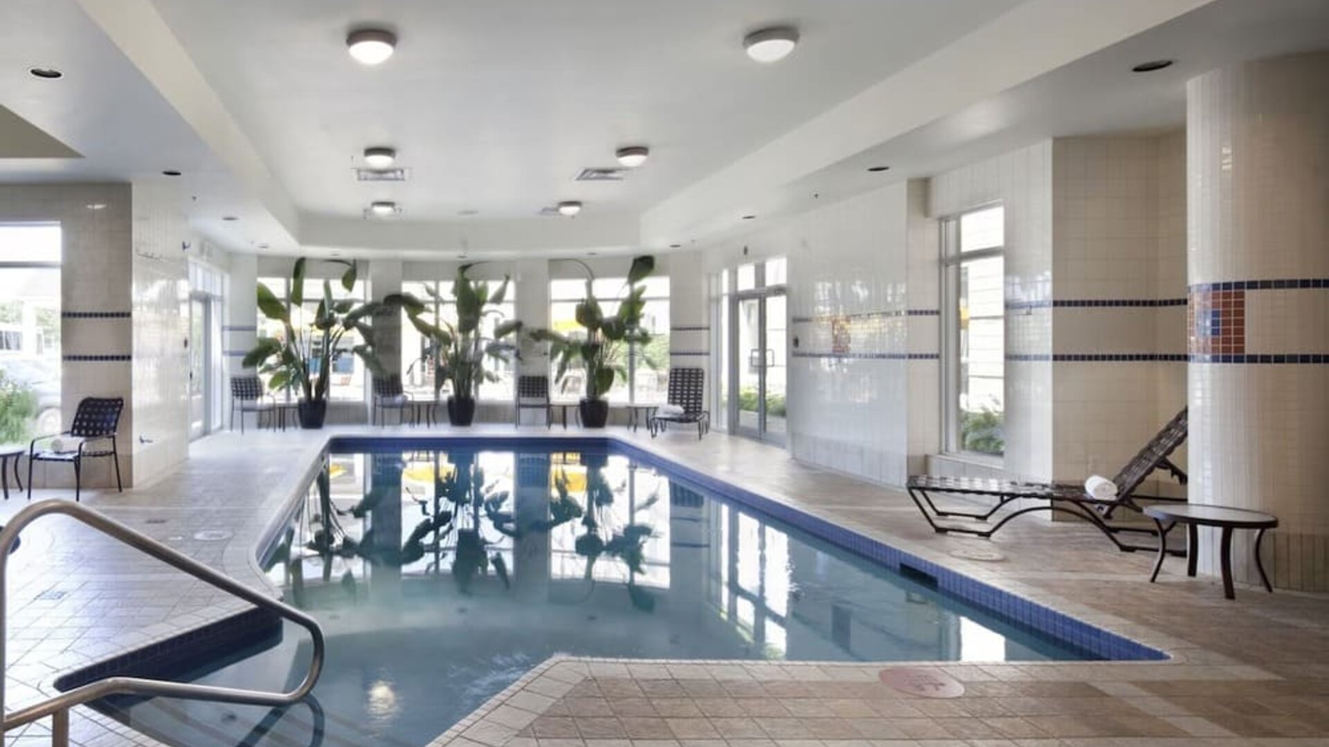 Indoor pool with natural light at Hilton Garden Inn Montreal Airport.