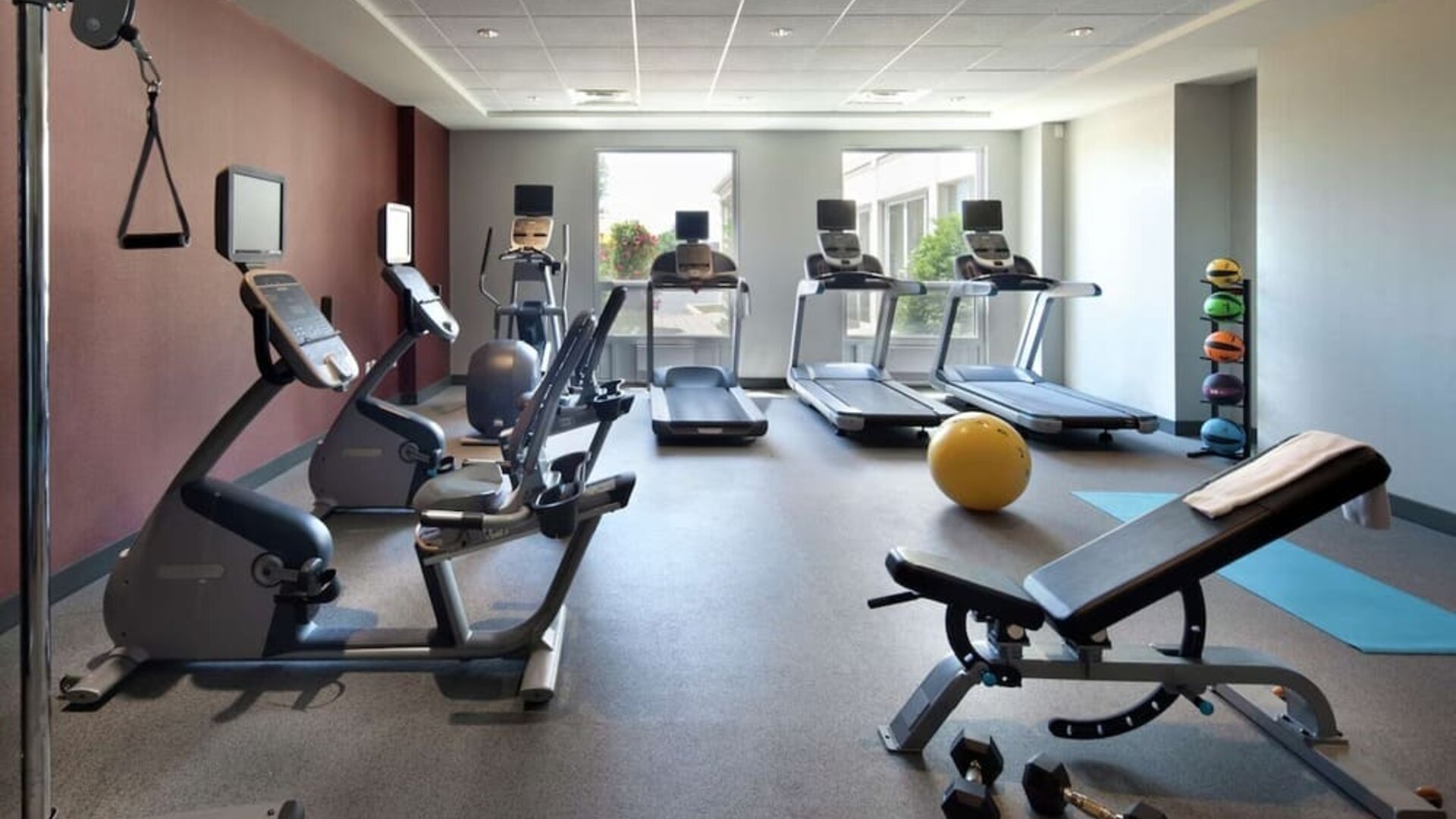 Fitness center complete with equipment at Hilton Garden Inn Montreal Airport.