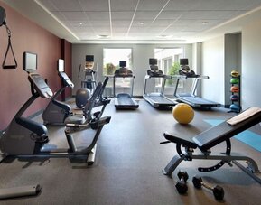 Fitness center complete with equipment at Hilton Garden Inn Montreal Airport.