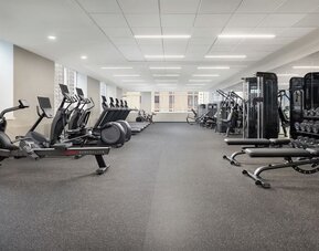 Large gym with cardio machines, weights, and strength equipment at Hyatt Regency Times Square.