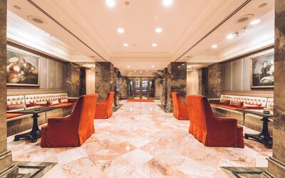 Elegant lobby seating area with classic decor and soft lighting at The Michelangelo New York.