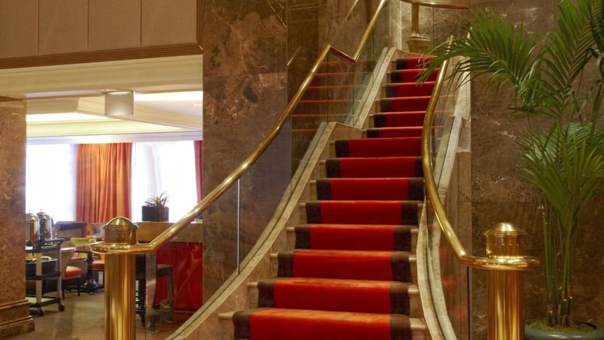 Lobby area with marble accents, upscale seating, and refined interior design at The Michelangelo New York.