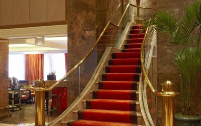 Lobby area with marble accents, upscale seating, and refined interior design at The Michelangelo New York.
