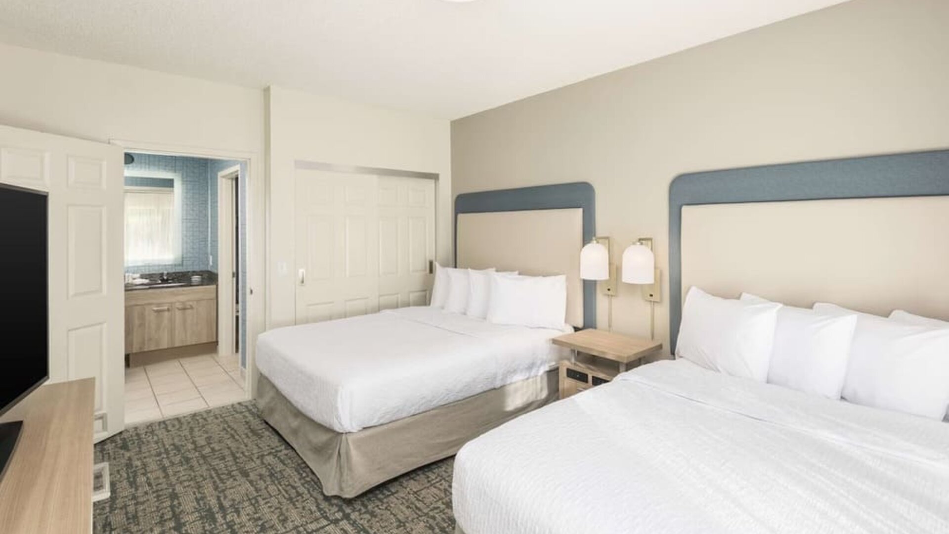 Guest room at Homewood Suites By Hilton Miami Airport-Blue Lagoon.