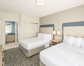 Guest room at Homewood Suites By Hilton Miami Airport-Blue Lagoon.