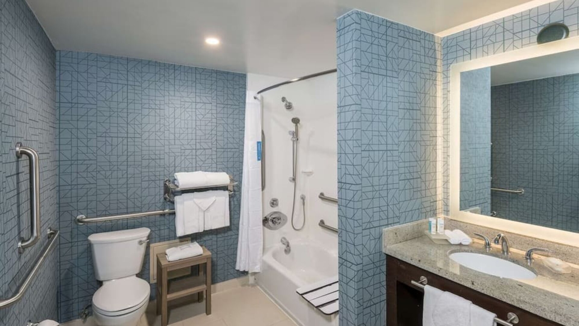 Guest bathroom with shower and tub at Homewood Suites By Hilton Miami Airport-Blue Lagoon.