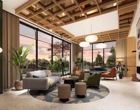 Contemporary hotel lounge with armchairs, wood-paneled walls, pendant lighting, and snack display