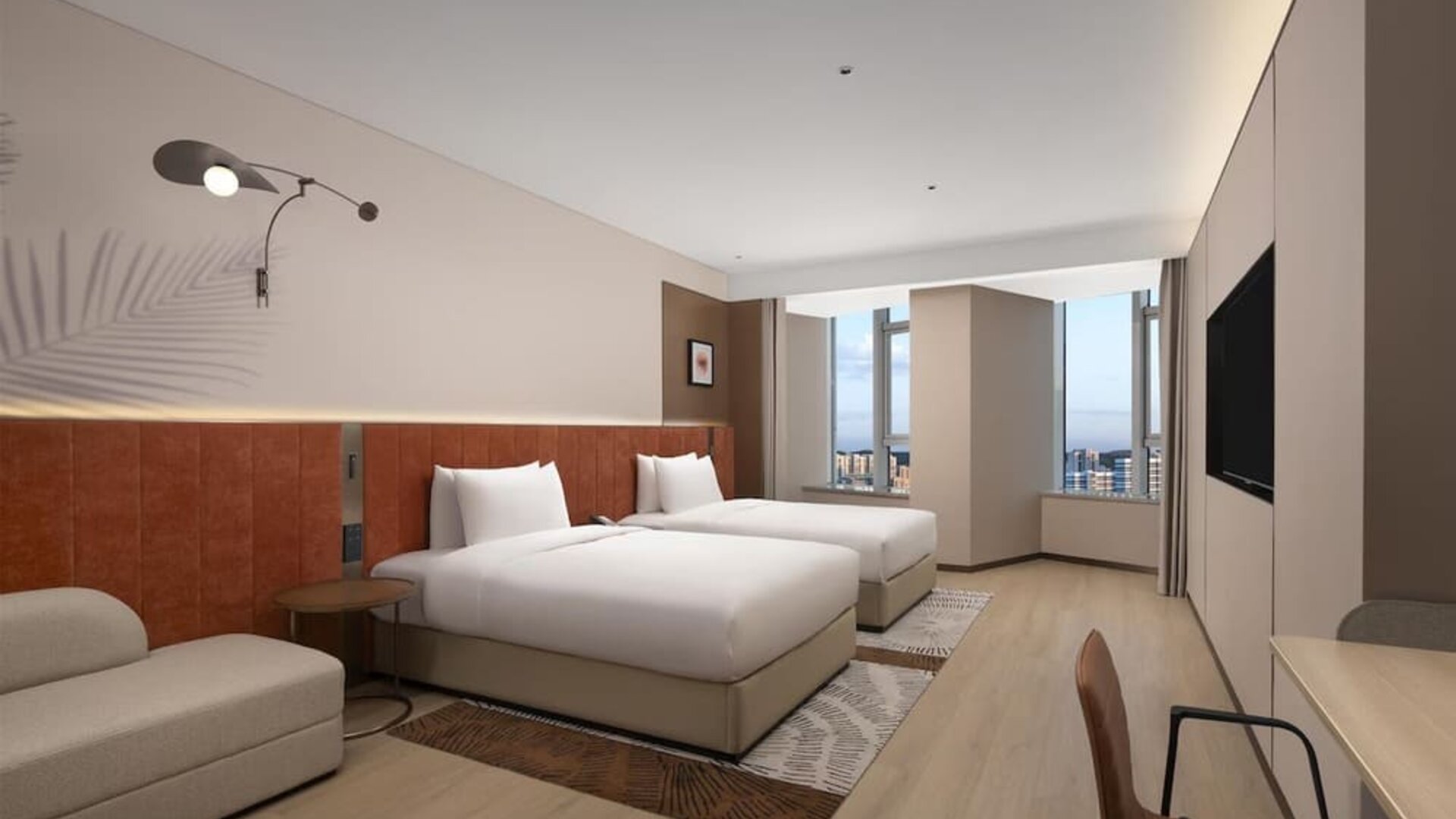 Modern double room with two beds, orange headboards, seating area, and floor-to-ceiling windows
