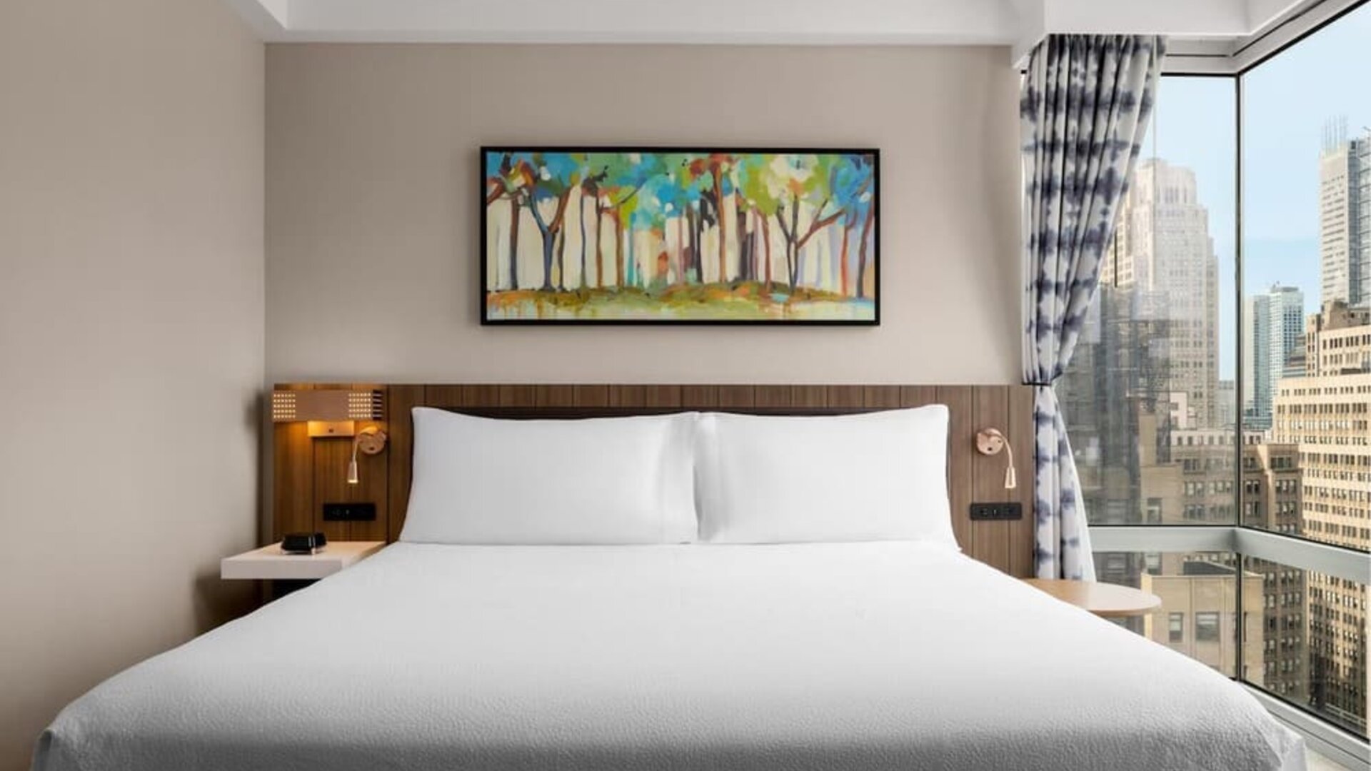 King room with skyline views at Hilton Garden Inn New York/West 35th Street.