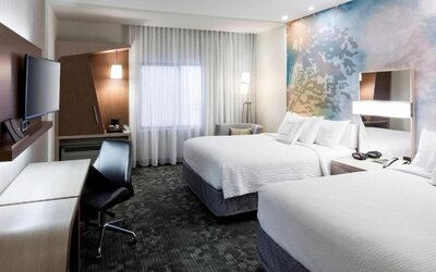 Double queen guest room with modern décor at Courtyard By Marriott Houston North/Shenandoah.