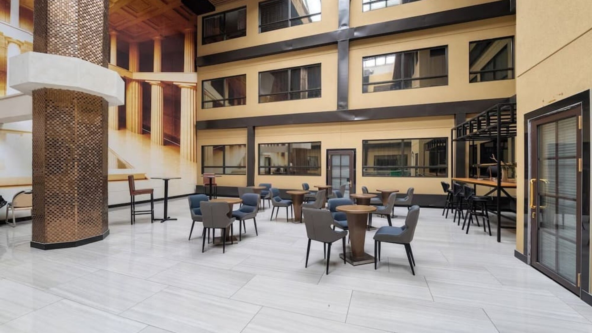 Open atrium seating area inside Hotel Montreal Metropolitan, An Ascend Collection Hotel.