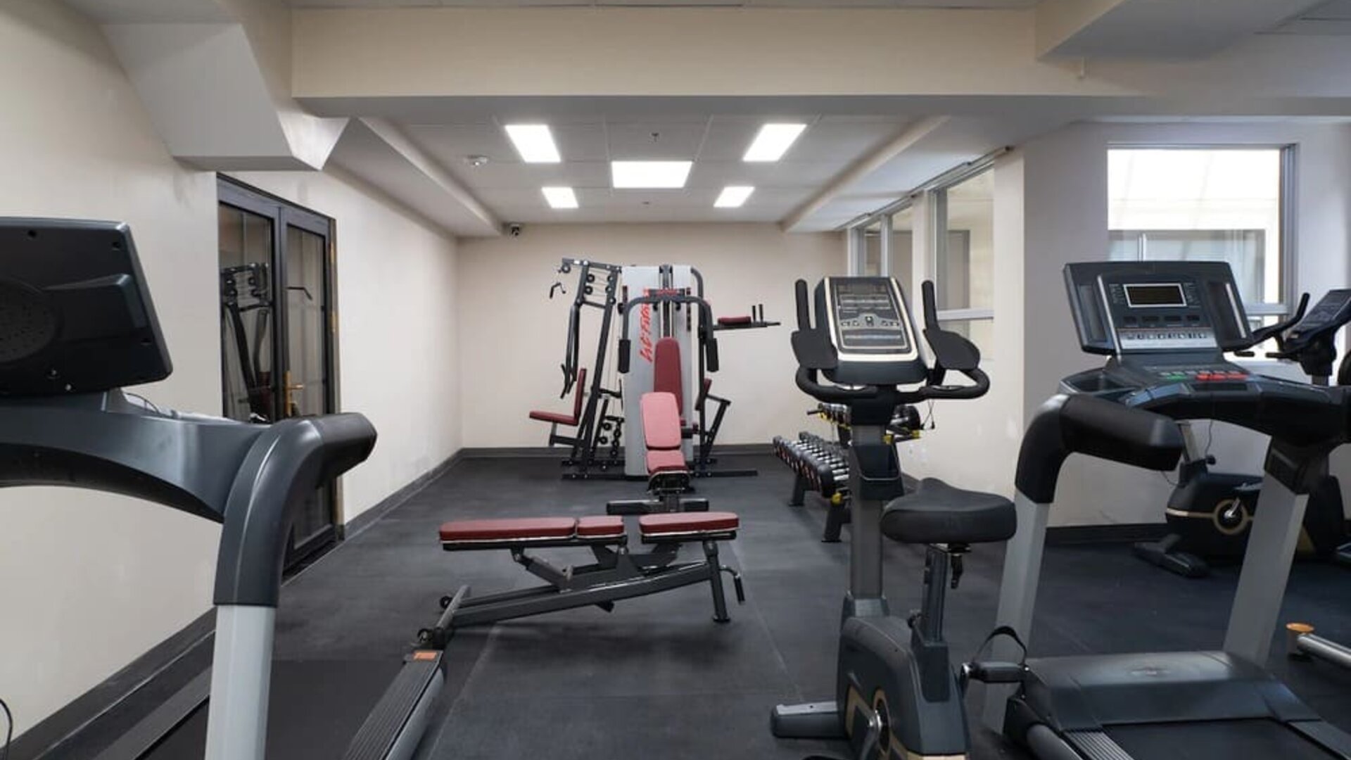 Fitness center with cardio machines and strength equipment at Hotel Montreal Metropolitan, An Ascend Collection Hotel.