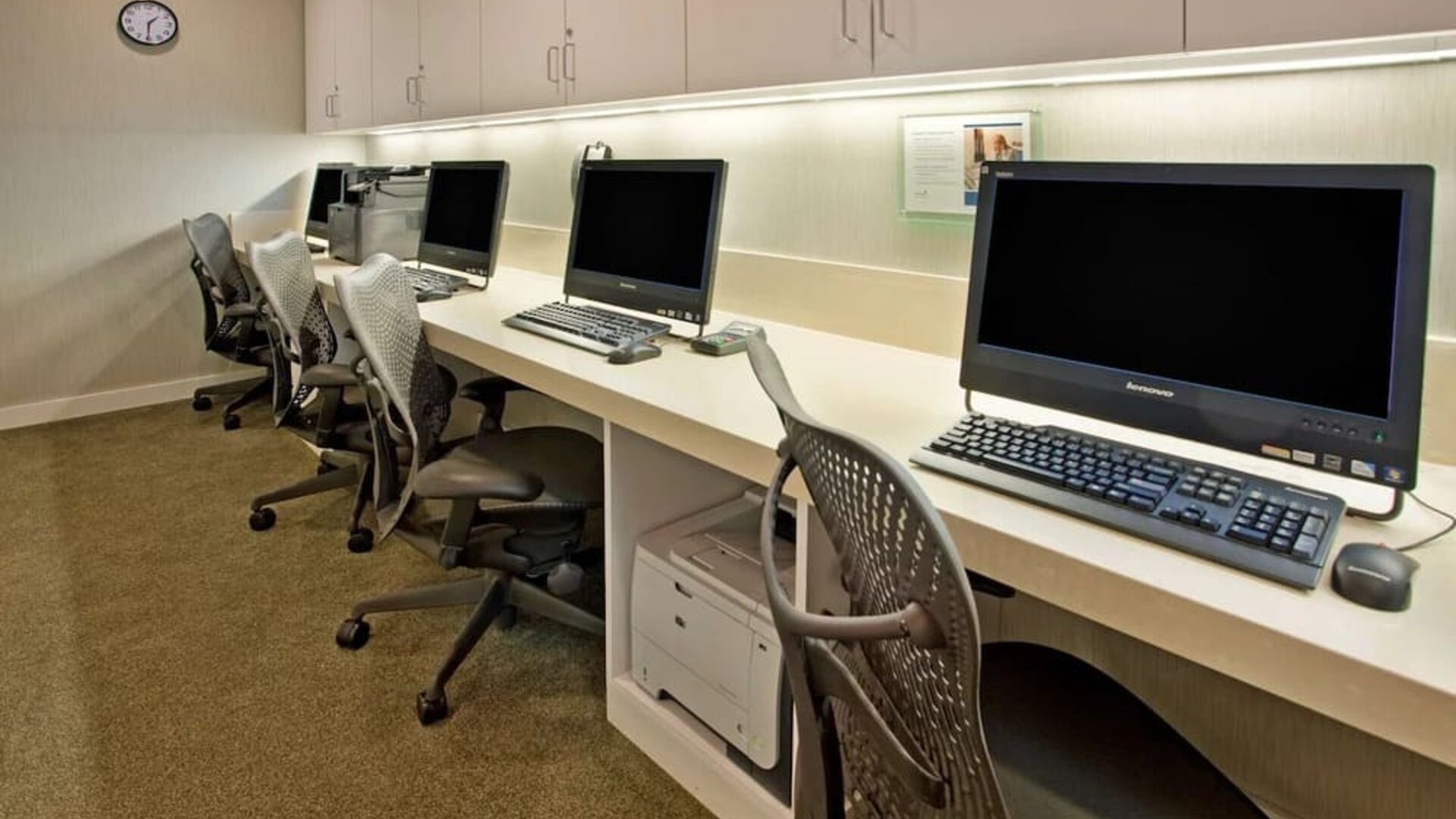 Business center with desktop computers and workstations at Hilton Garden Inn New York Central Park South-Midtown West.