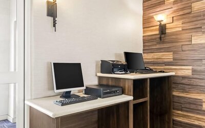 Business center with computers and printing facilities at La Quinta Inn & Suites By Wyndham Houston Energy Corridor.