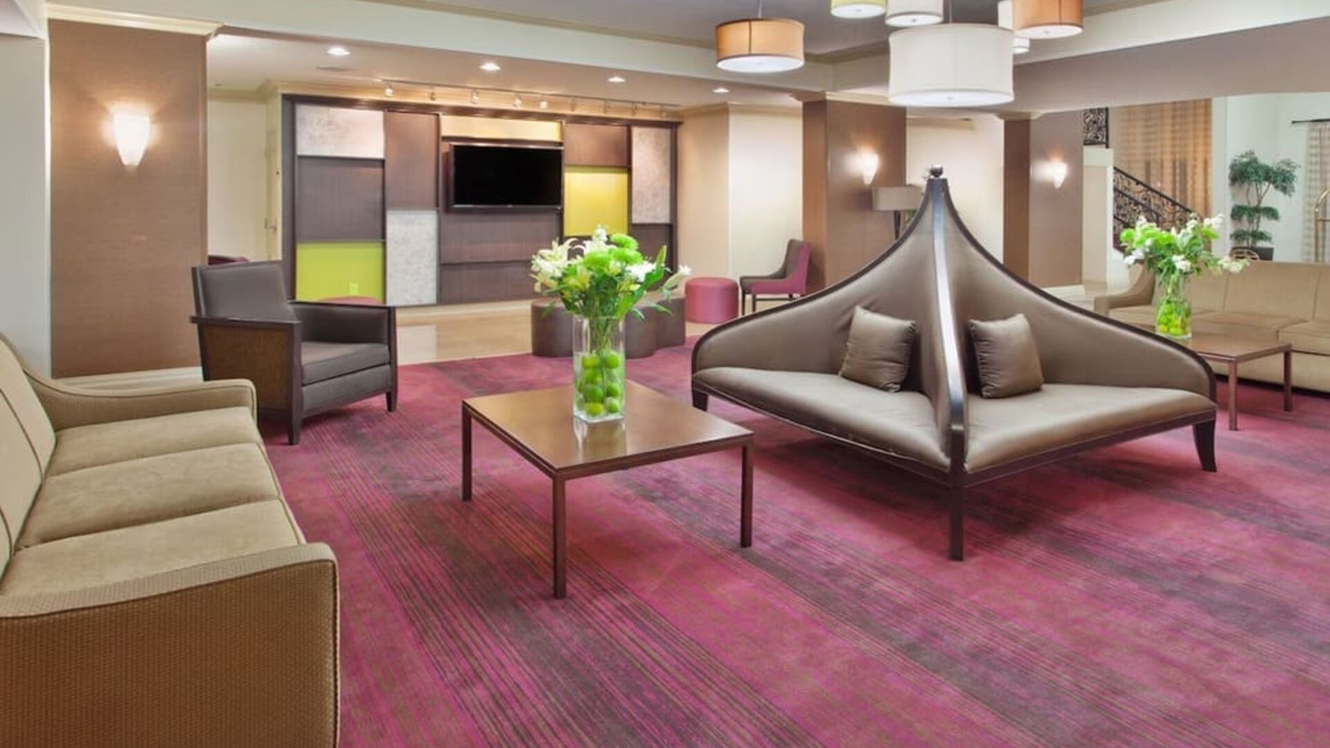Modern hotel lobby seating area with contemporary furnishings at Holiday Inn Downtown Shreveport.