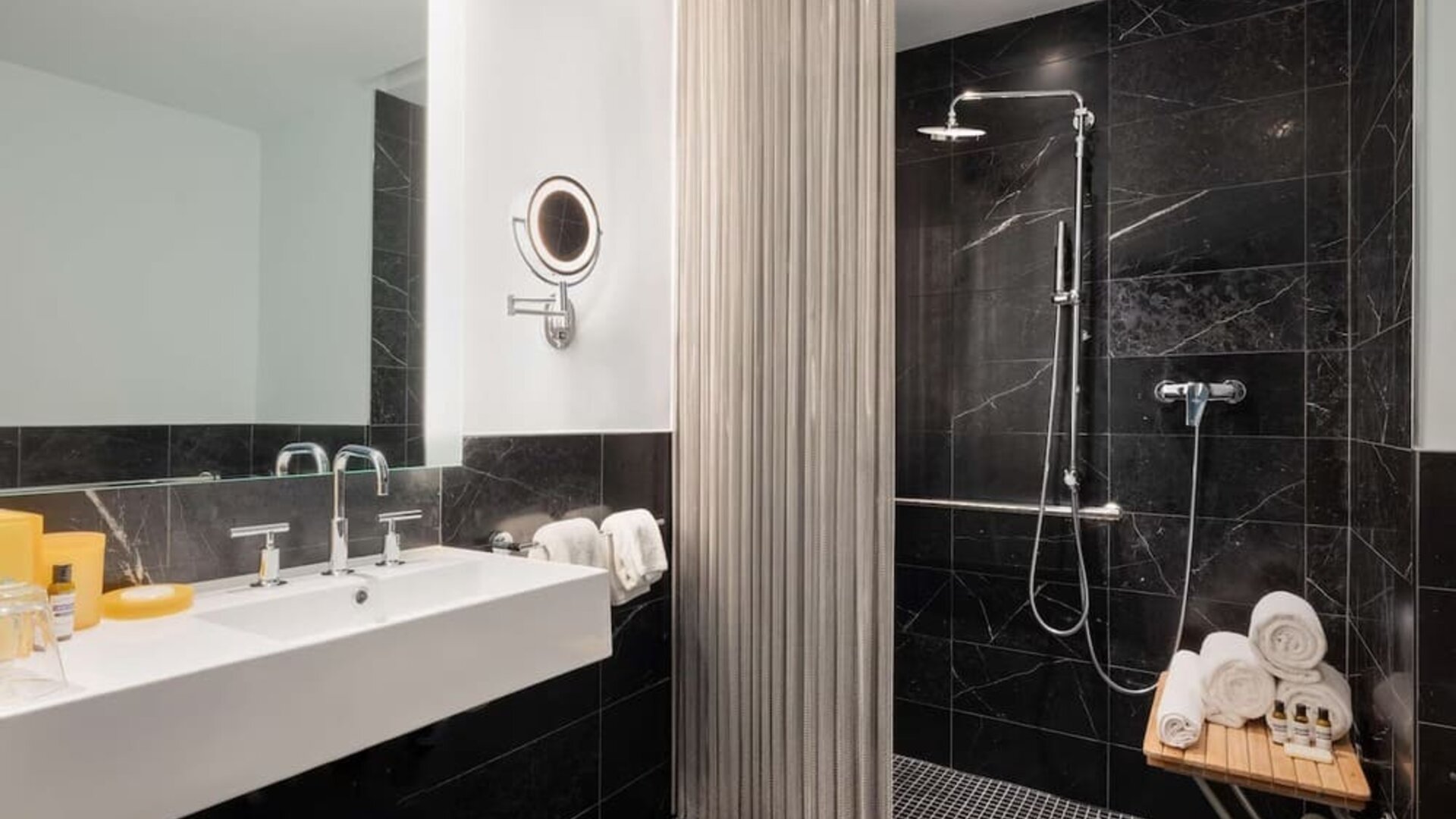 Luxury bathroom with walk-in rainfall shower and marble finishes at Hyatt Union Square New York.