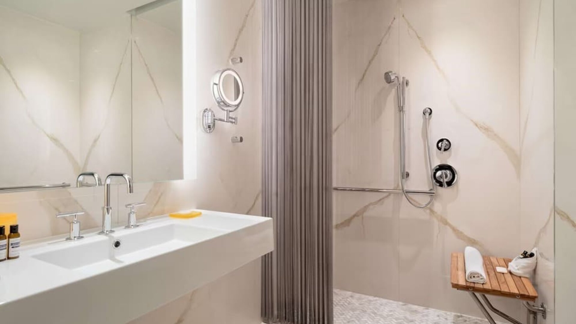 Modern marble bathroom with accessible walk-in shower at Hyatt Union Square New York.