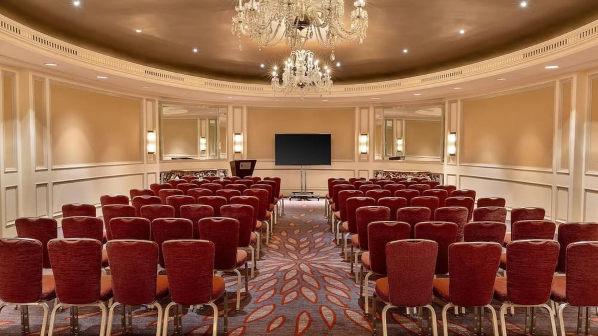 Ballroom-style meeting and event space with chandelier lighting and theater seating at Hyatt Regency Boston.