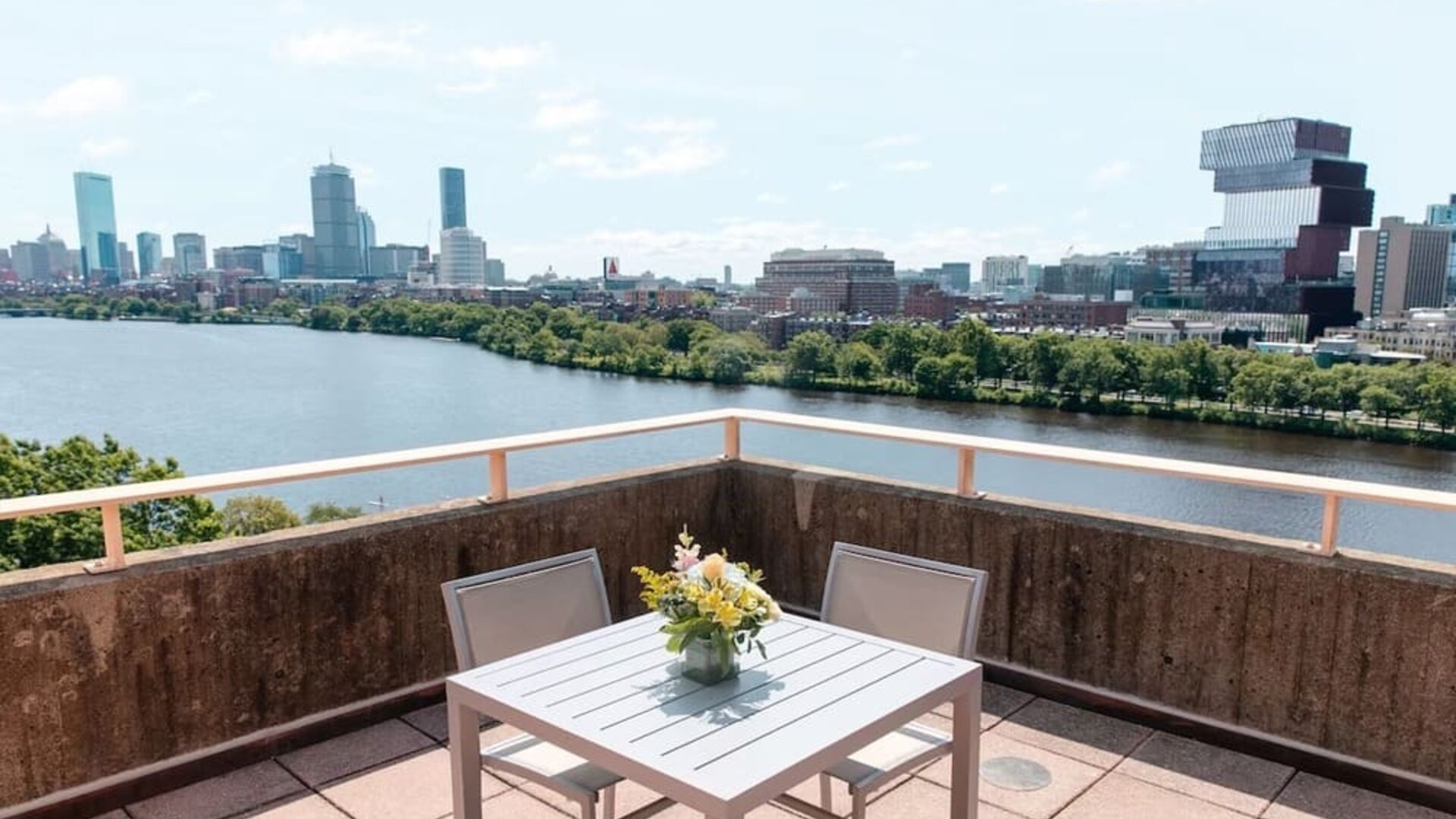 Rooftop-style terrace overlooking the Charles River and Boston skyline at Hyatt Regency Boston/Cambridge.