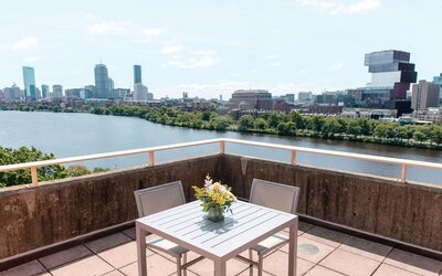 Rooftop-style terrace overlooking the Charles River and Boston skyline at Hyatt Regency Boston/Cambridge.